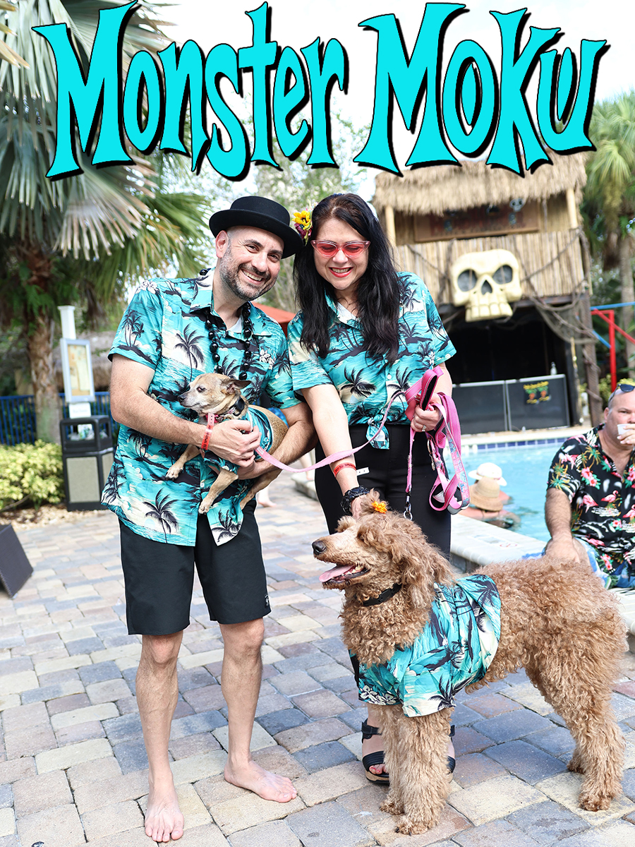 A couple and their dogs dressed for Monster Moku