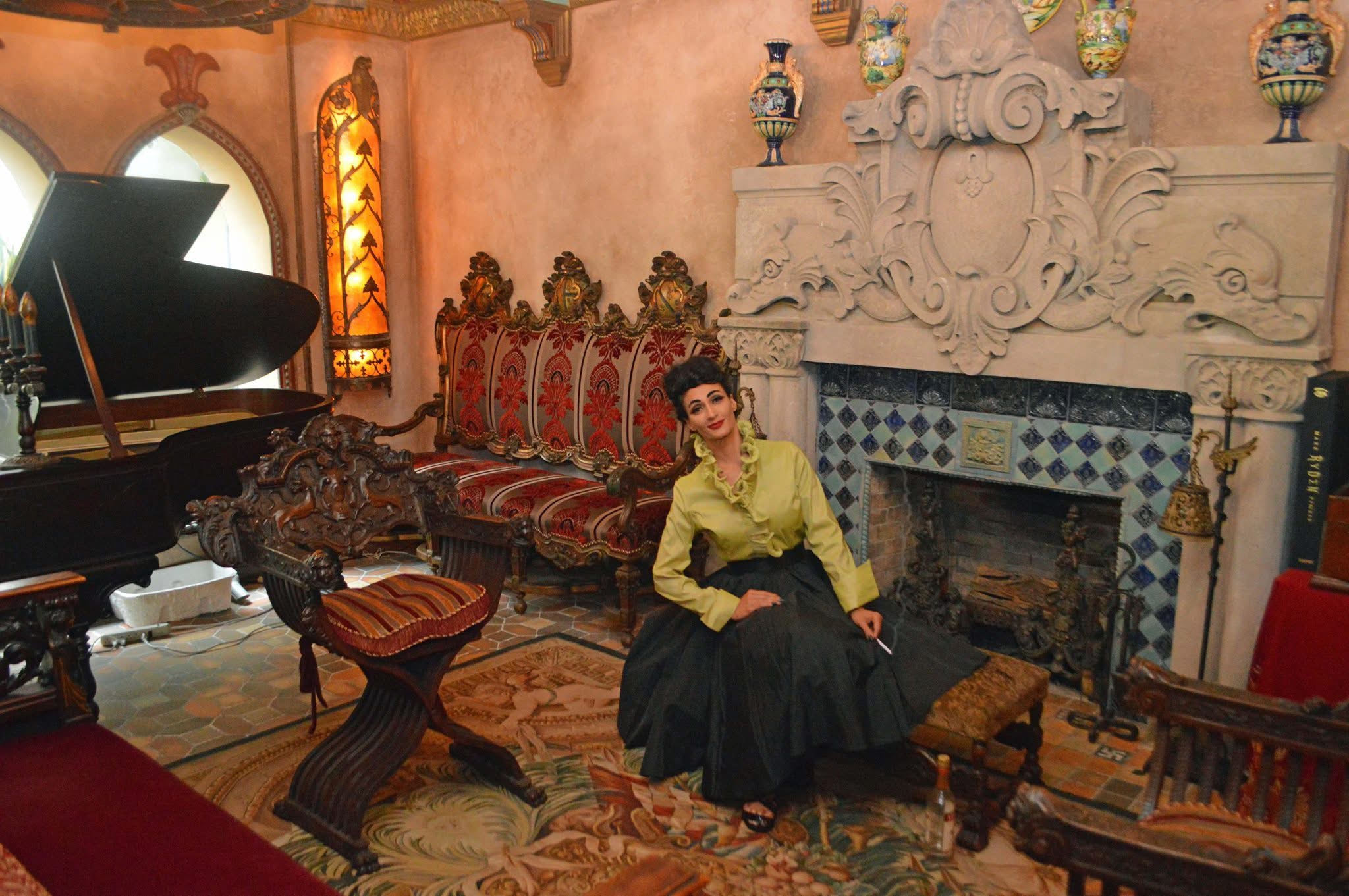 MeduSirena seated in a lavish old mansion evoking a classic gothic thriller